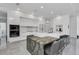 Modern kitchen boasts a large island, stainless steel appliances, and sleek cabinets, creating a chef's dream space at 12177 Gray Birch Cir, Orlando, FL 32832