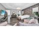 Spacious main bedroom features a tray ceiling, seating area, and a wall of textured wallpaper at 12177 Gray Birch Cir, Orlando, FL 32832