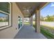 A home's back patio features ceiling fans and views of the green backyard at 1252 Ash Tree Cv, Casselberry, FL 32707