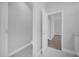 A half bathroom opens into the home's bedroom, featuring white tiling and a large sink at 1252 Ash Tree Cv, Casselberry, FL 32707