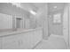 A bathroom with double vanity sinks, a large mirror, and a walk in shower at 1252 Ash Tree Cv, Casselberry, FL 32707
