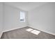 Comfortable bedroom features soft carpet, baseboard trim and one window at 1252 Ash Tree Cv, Casselberry, FL 32707