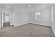 Bright bedroom with plush carpet, trim, an entry way and one window at 1252 Ash Tree Cv, Casselberry, FL 32707