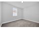 Empty bedroom with carpet, trim, and one window at 1252 Ash Tree Cv, Casselberry, FL 32707