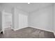 Well-lit bedroom with soft carpet, closet, and attached space for storage at 1252 Ash Tree Cv, Casselberry, FL 32707