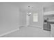 A dining room offers a stainless steel refrigerator and plenty of space to entertain guests at 1252 Ash Tree Cv, Casselberry, FL 32707