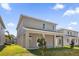 A new build home shows off its backyard and partially covered patio at 1252 Ash Tree Cv, Casselberry, FL 32707