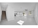 Open-concept living space with tile floors connects the living area to the kitchen and staircase at 1252 Ash Tree Cv, Casselberry, FL 32707