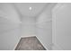 A bedroom walk-in closet with carpeted floor and wire shelving at 1252 Ash Tree Cv, Casselberry, FL 32707