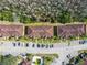 Aerial view showcasing the community buildings, parking spaces, and mature landscaping at 13829 Timberland Dr # 204, Orlando, FL 32824