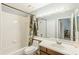 A full bathroom featuring tile surround shower and tub combination and a large mirror with vanity lighting at 13829 Timberland Dr # 204, Orlando, FL 32824
