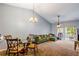 The living room features an open layout, carpeted floors and sliding glass doors to the outside at 13829 Timberland Dr # 204, Orlando, FL 32824