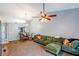 The living room features an open layout, high ceiling, and flows into the dining area at 13829 Timberland Dr # 204, Orlando, FL 32824