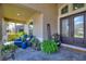 Inviting front porch with comfortable seating and stylish decor at 13942 Jomatt Loop, Winter Garden, FL 34787