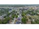 An aerial view highlighting neighborhood homes with green landscaping, near a highway and commercial areas at 1545 Indiana Ave # B, Winter Park, FL 32789