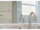 Bathroom sink, granite countertop, and vanity reflected in the mirror at 1545 Indiana Ave # B, Winter Park, FL 32789