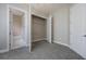 Bedroom with carpet and view to bathroom, closet and hall at 1545 Indiana Ave # B, Winter Park, FL 32789