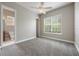Bright bedroom with an attached bathroom, neutral walls and plush carpeting at 1545 Indiana Ave # B, Winter Park, FL 32789