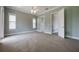 Spacious bedroom with a ceiling fan, carpet, and natural light from windows at 1545 Indiana Ave # B, Winter Park, FL 32789