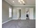 Bedroom featuring a ceiling fan, neutral carpet, and interior doors at 1545 Indiana Ave # B, Winter Park, FL 32789