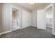 Bedroom features carpet flooring, a ceiling fan and two door closets at 1545 Indiana Ave # B, Winter Park, FL 32789