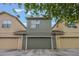 View showing the 3-car garage with carriage lamps on either side at 1545 Indiana Ave # B, Winter Park, FL 32789