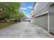 View of the exterior with 3-car garage and long driveway at 1545 Indiana Ave # B, Winter Park, FL 32789