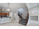 Open foyer with staircase, tile flooring, leading to kitchen and living areas at 1545 Indiana Ave # B, Winter Park, FL 32789