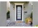 Close up view of the front entrance door to home #1545 showing a 'Welcome' mat at 1545 Indiana Ave # B, Winter Park, FL 32789