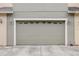Close up of the garage door with detailed windows and carriage lamps at 1545 Indiana Ave # B, Winter Park, FL 32789