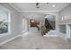 Bright and airy living space with tile floors, staircase, and views into the kitchen at 1545 Indiana Ave # B, Winter Park, FL 32789