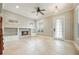 Cozy living room space with tile flooring, a fireplace, and windows to let the sun shine in at 1545 Indiana Ave # B, Winter Park, FL 32789