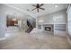Open-concept living room with tile flooring, fireplace, and seamless transition to the kitchen at 1545 Indiana Ave # B, Winter Park, FL 32789