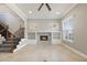 Inviting living room featuring a stone fireplace, built-in shelving, and plenty of natural light at 1545 Indiana Ave # B, Winter Park, FL 32789