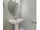 Simple pedestal sink in a conveniently located powder room at 1545 Indiana Ave # B, Winter Park, FL 32789