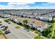 Aerial view showcases community with tile roofs, screened patios, and parking at 1554 Plunker Dr, Davenport, FL 33896