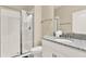 Bathroom features a glass-enclosed shower and vanity with granite countertop at 1554 Plunker Dr, Davenport, FL 33896