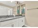 Bathroom features double sink with granite countertop and modern fixtures at 1554 Plunker Dr, Davenport, FL 33896