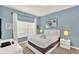 Cozy bedroom with plush carpet, a comfortable bed, and stylish decor creates a serene and inviting retreat at 1554 Plunker Dr, Davenport, FL 33896
