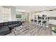 Open concept living room showcasing kitchen, dining area, and comfortable seating, creating a welcoming and cohesive space at 1554 Plunker Dr, Davenport, FL 33896