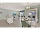 Open-concept living and dining space with sliding doors to a patio and outdoor space at 1554 Plunker Dr, Davenport, FL 33896