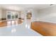 Bright living room with hardwood floors and a view into another room at 1672 Wingspan Way, Winter Springs, FL 32708