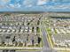 Aerial view of the community showcasing the neighborhood layout, nearby lakes, and surrounding area at 1860 Tohoqua Blvd, Kissimmee, FL 34744