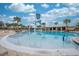 Community pool with recreational water features perfect for ; lounge chairs and shady cabanas nearby at 1860 Tohoqua Blvd, Kissimmee, FL 34744