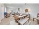 Well-lit dining area featuring a wooden table, bench, and chairs with stylish decor at 1860 Tohoqua Blvd, Kissimmee, FL 34744