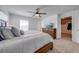 Main bedroom features a large bed, ceiling fan and walk-in closet at 1860 Tohoqua Blvd, Kissimmee, FL 34744