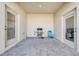 Covered patio space with a grill and ample room for seating at 1860 Tohoqua Blvd, Kissimmee, FL 34744