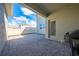 Open patio area with brick pavers, white fencing, and a covered area with a door to the interior at 1860 Tohoqua Blvd, Kissimmee, FL 34744