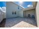 Spacious brick patio with a grill, a chair, and a view of the home's exterior at 1860 Tohoqua Blvd, Kissimmee, FL 34744
