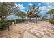 Outdoor picnic area with a large pavilion, tables, chairs, and a grill at 1860 Tohoqua Blvd, Kissimmee, FL 34744